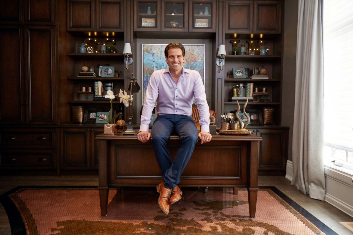 scott mcgillivray sitting on office desk
