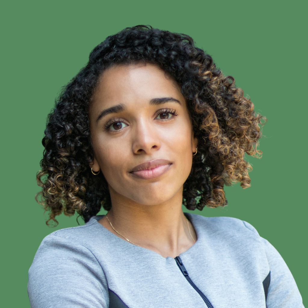 Alexandra McCalla in grey jacket and green background