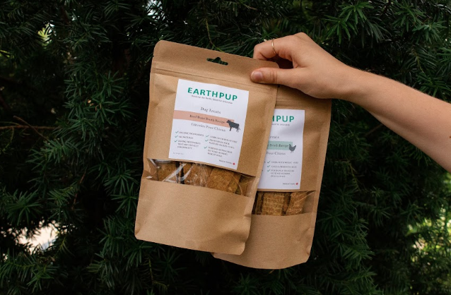 Hand holding EarthPup bags