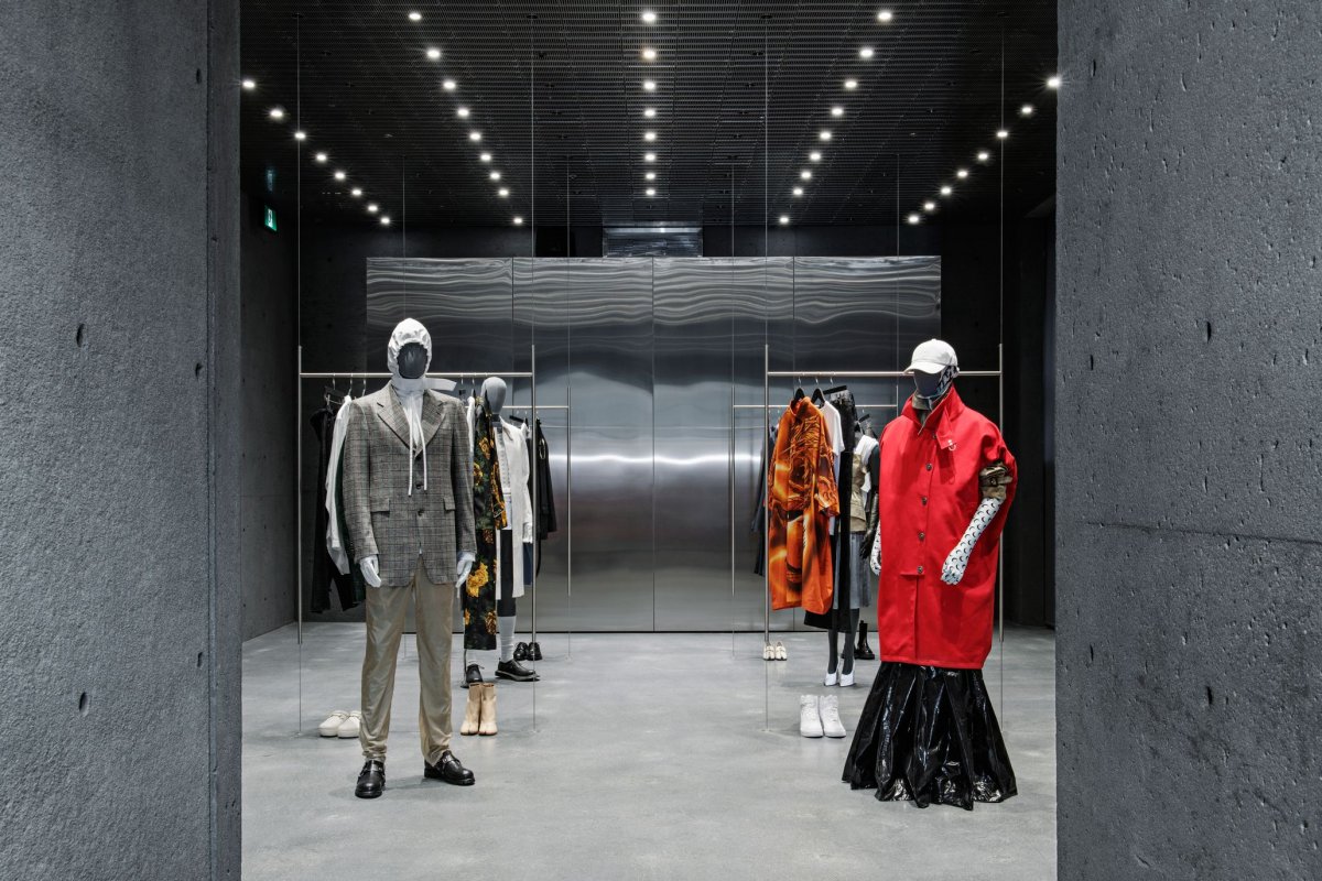 minimal interior with mannequins wearing high fashion clothing at SSENSE
