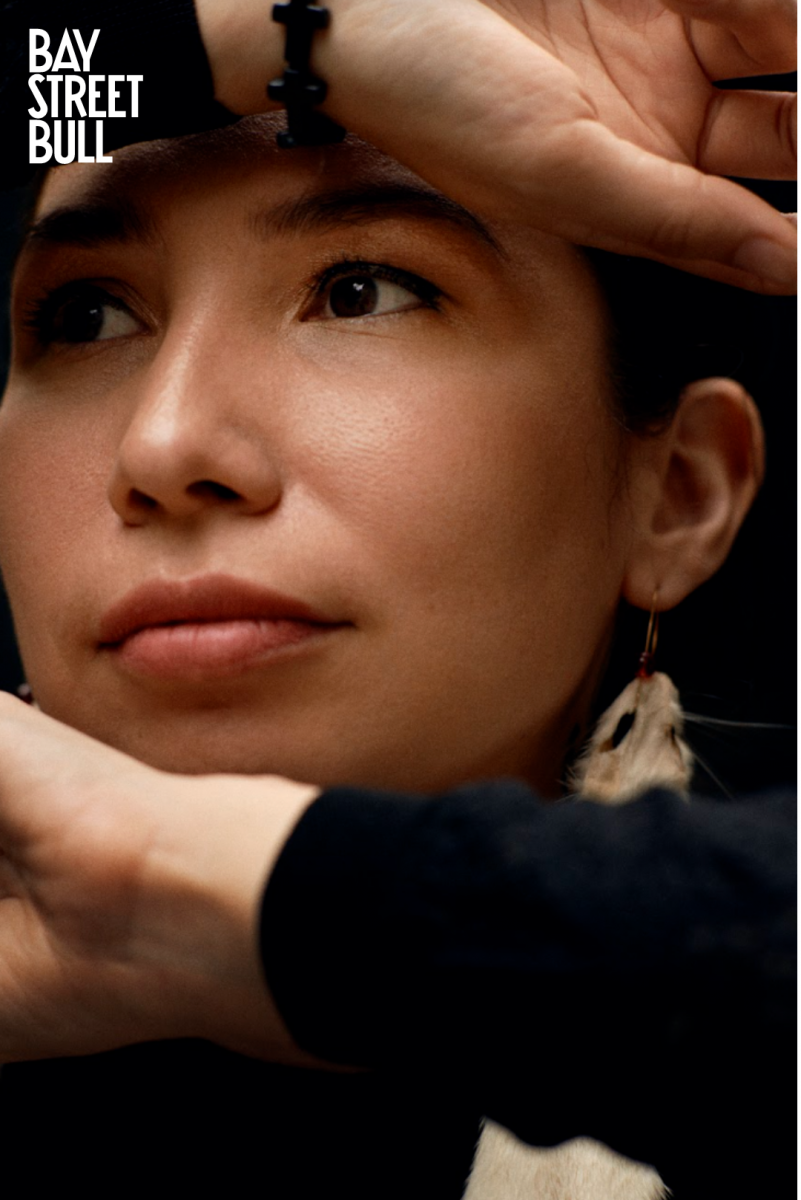 Closeup of Sage Paul's face with hands displayed overtop